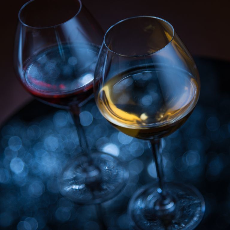 Two Wine Glasses With Red Liquid