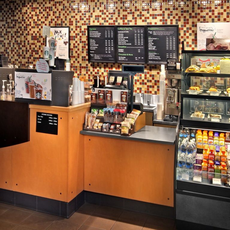 A Counter With Menus And Drinks